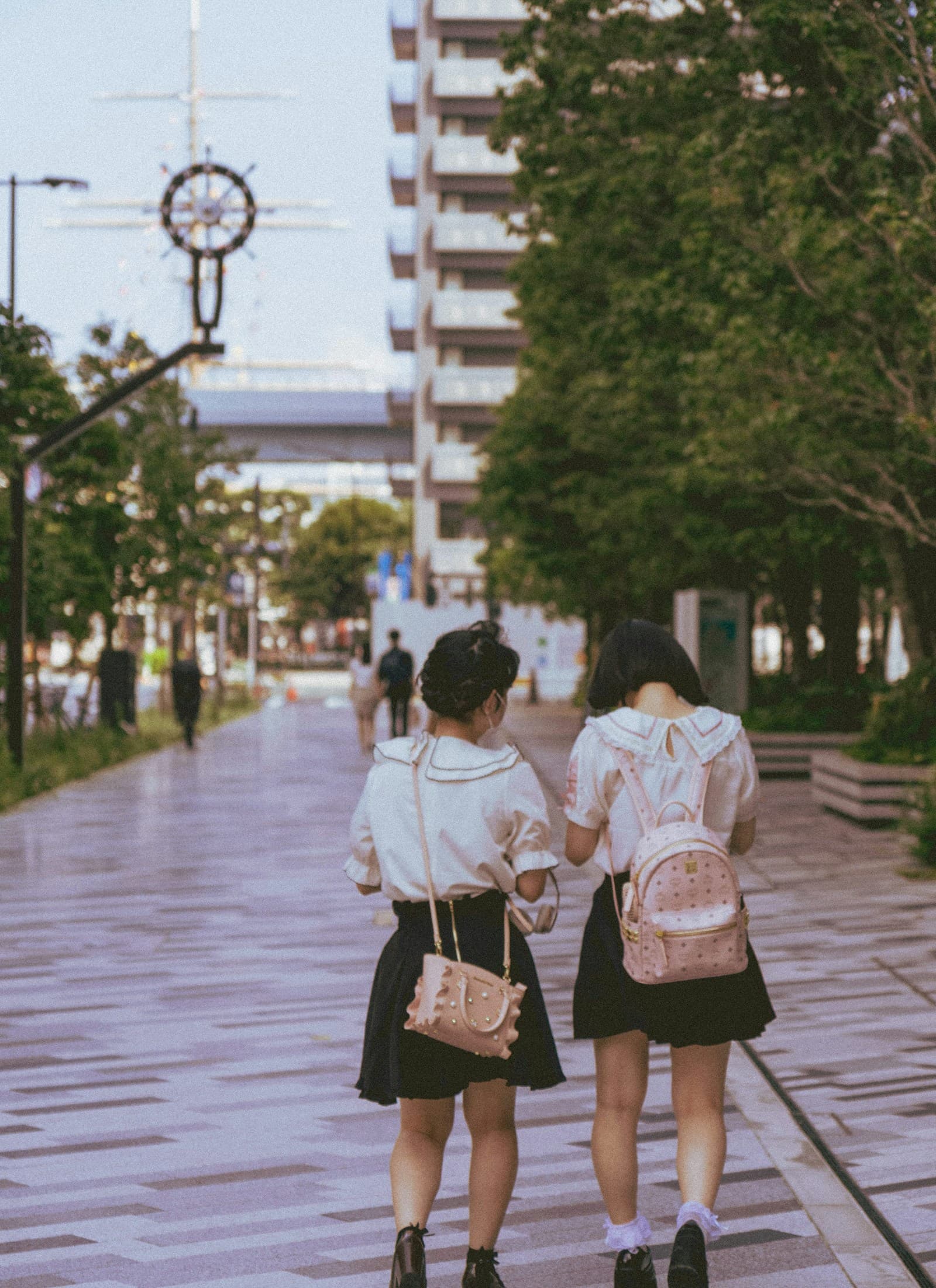 Two women walking side by side