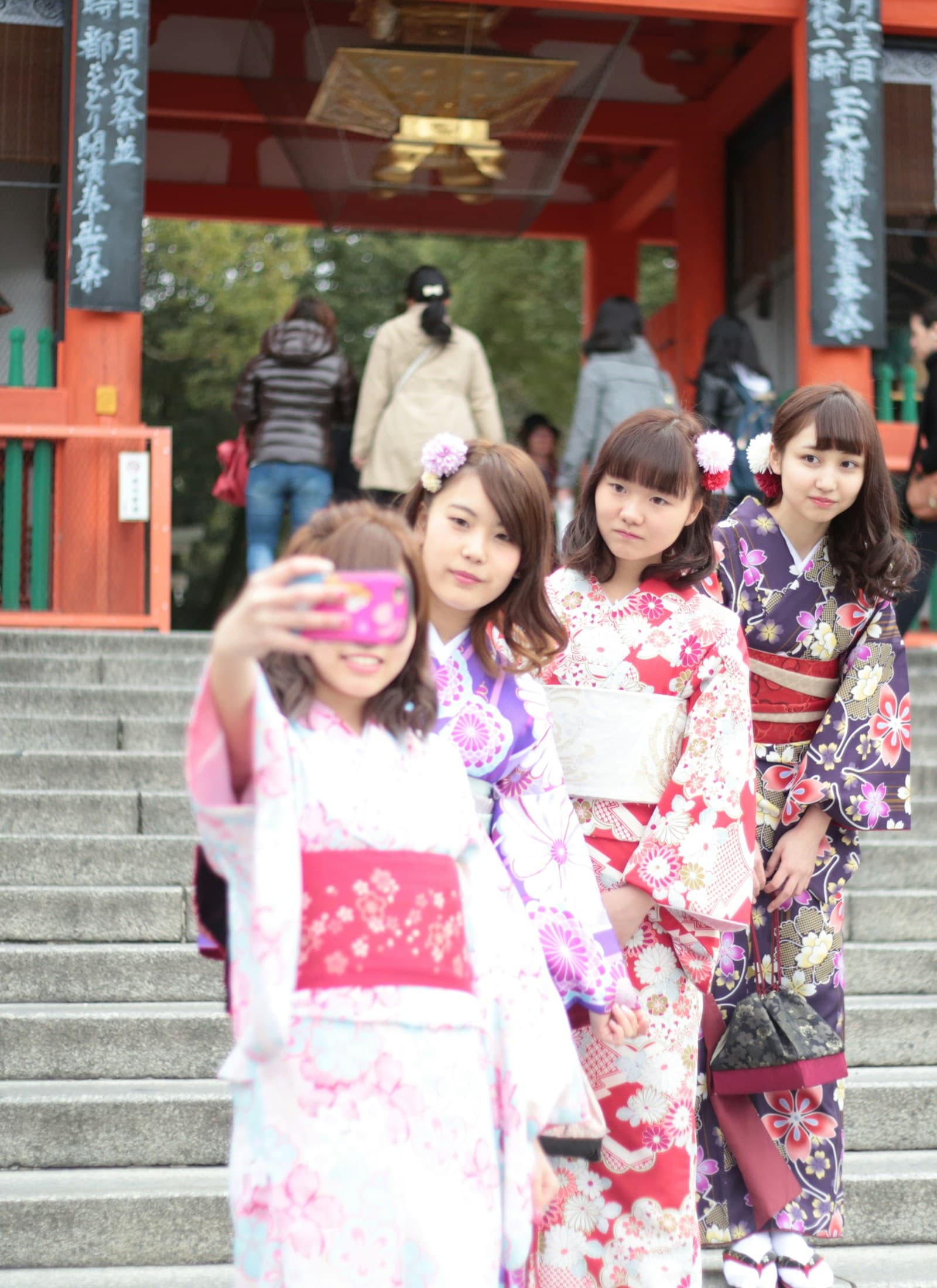 Friends taking a selfie in patterned kimonos