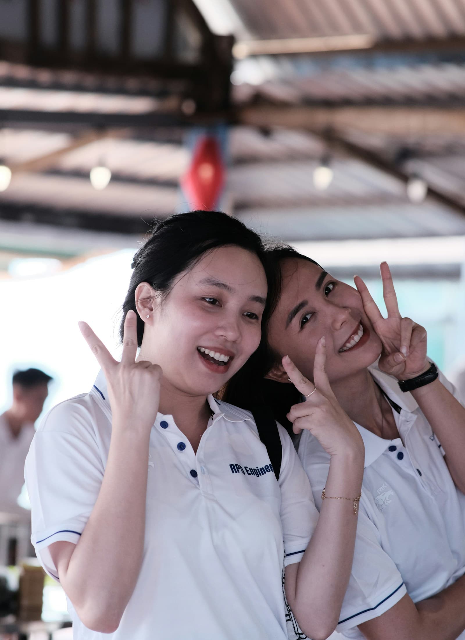 Two women giving a peace sign