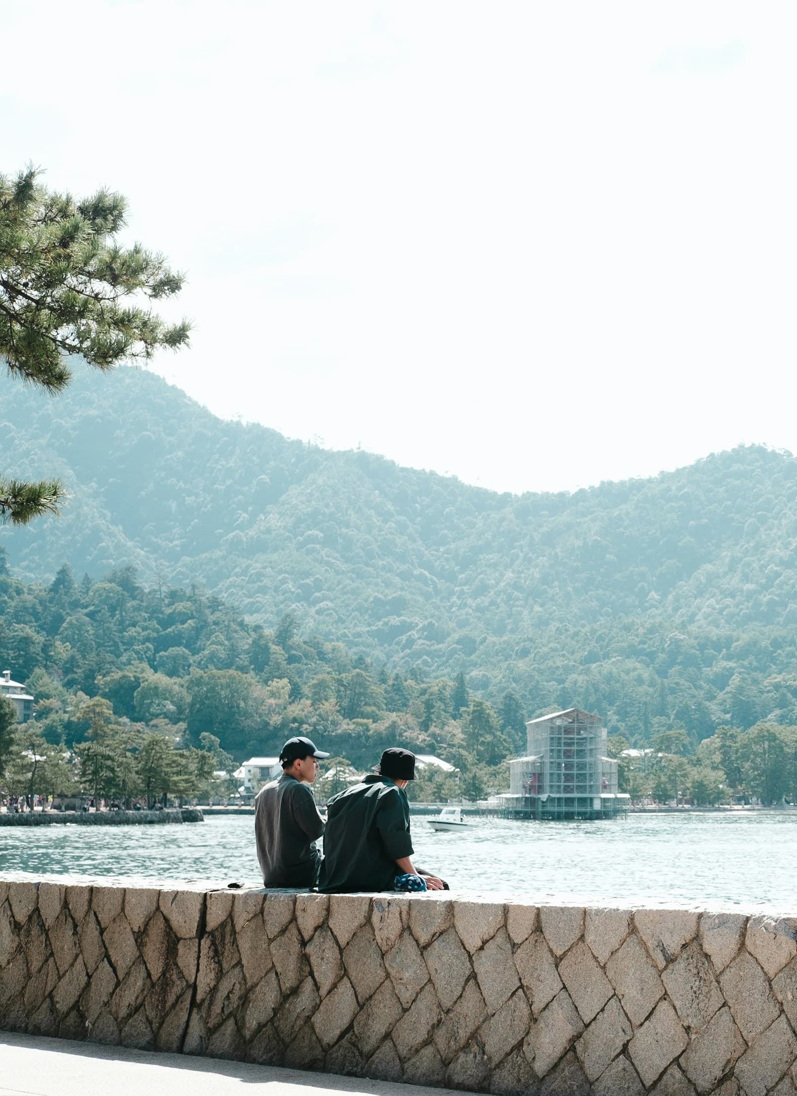 Couple sitting together by the water